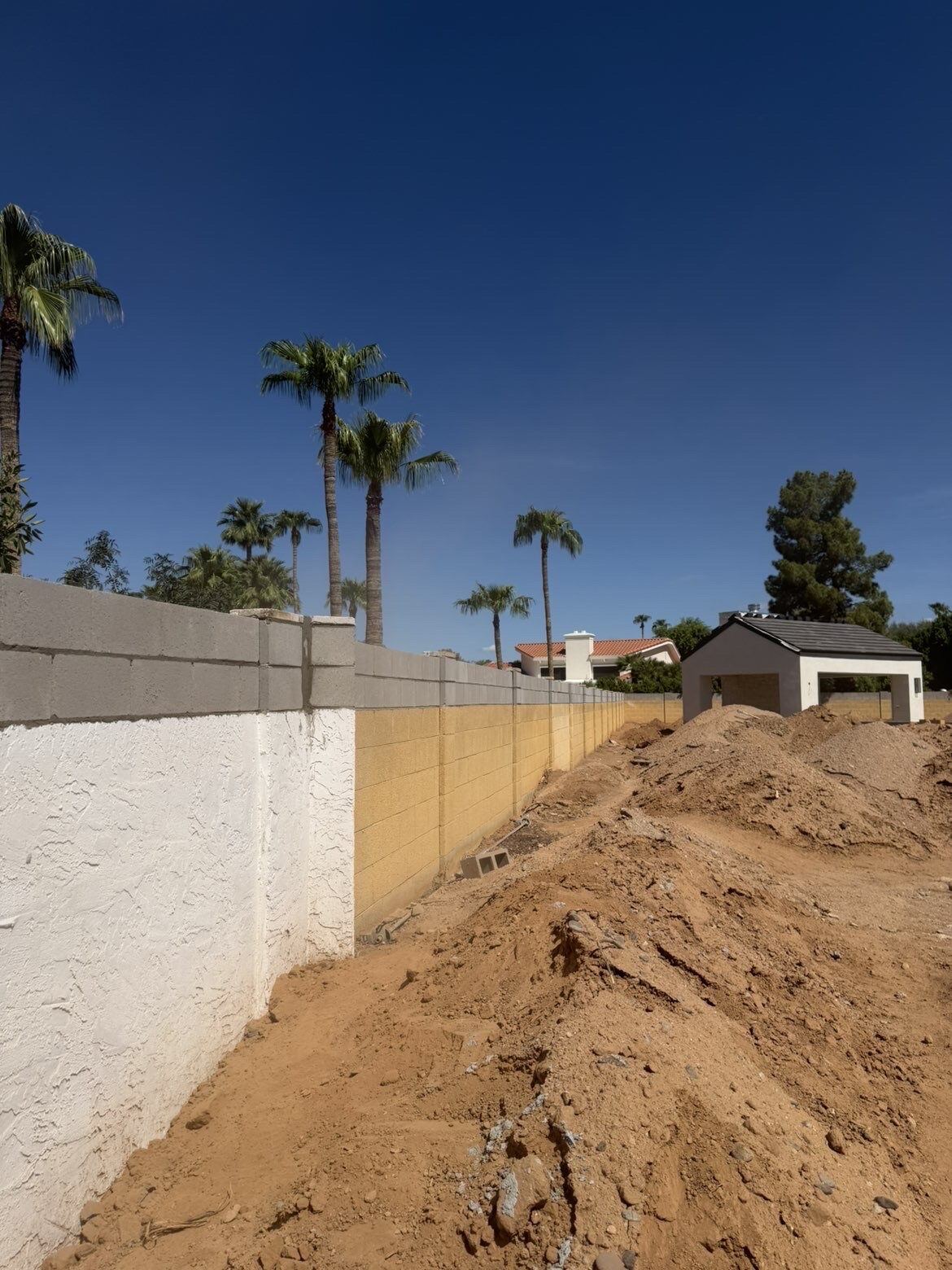 Two-material perimeter wall, backfill staged, Phoenix Metro, AZ
